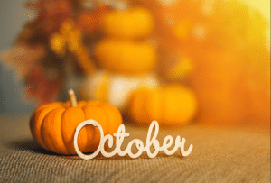 Wooden October sign with pumpkins and autumn leaves for Eco-Safe Pest Control's DFW fall pest-control article.